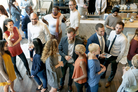 Photo of people at a cocktail party for a networking event.