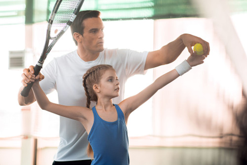 Picture of a dad teaching his daughter to be independent with procedural language.